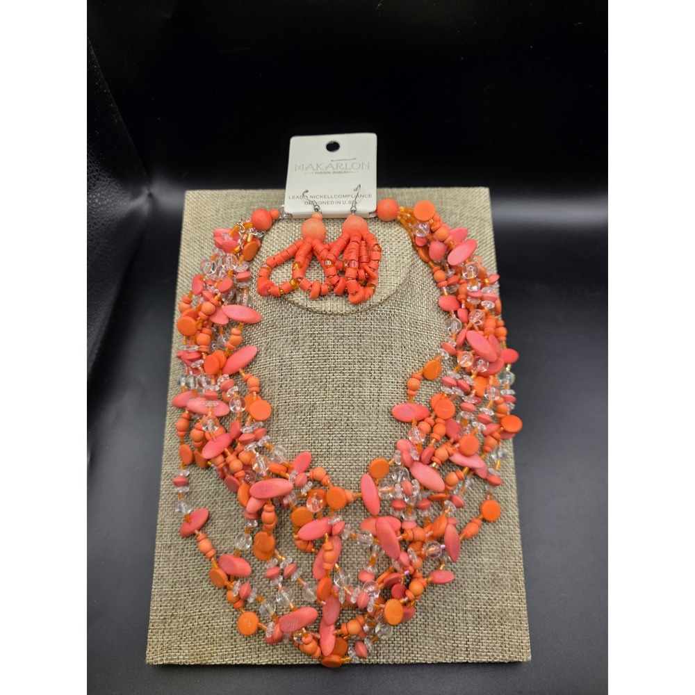 Makarlon brand necklace set features layered chunky orange & Clear Beads